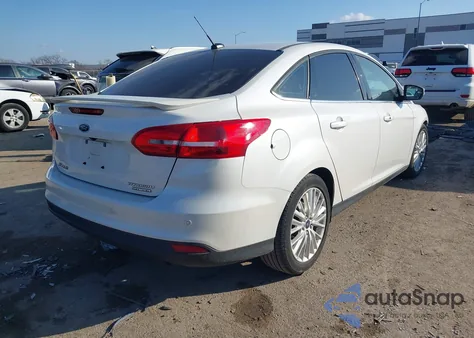 2016 Ford Focus Titanium z USA, uszkodzony, nr VIN 1FADP3J21GL274689